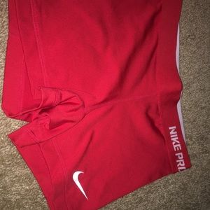 Red Nike Pros, size XS